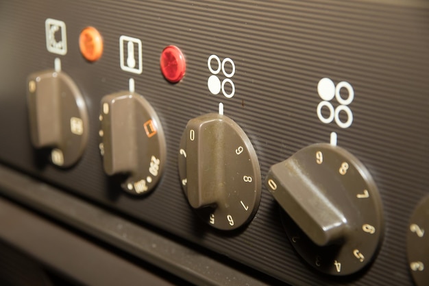 Photo close-up of knobs with numbers on machinery