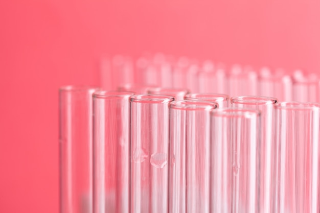 Close up laboratory test tubes on red