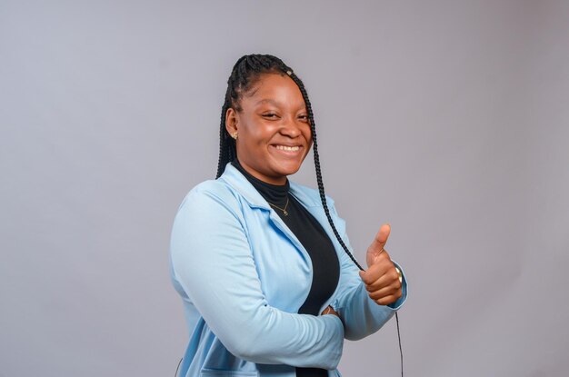 Close up of a lady isolated over white background smiling and did thumbs up