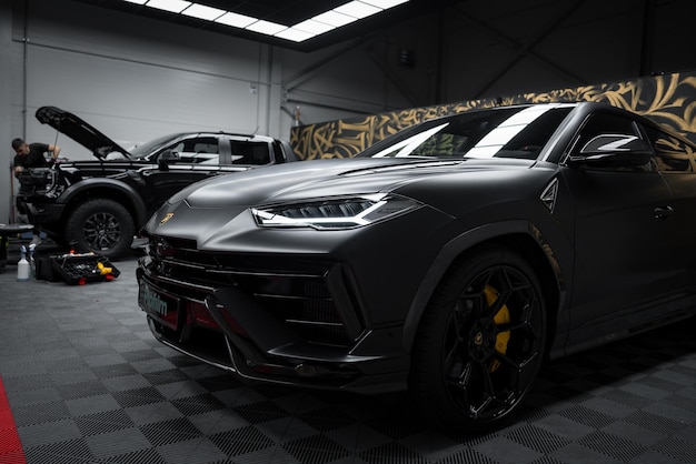 Close up of lamborghini urus performante in automotive workshop