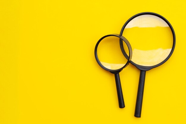 Close-up of lamp on table against yellow background