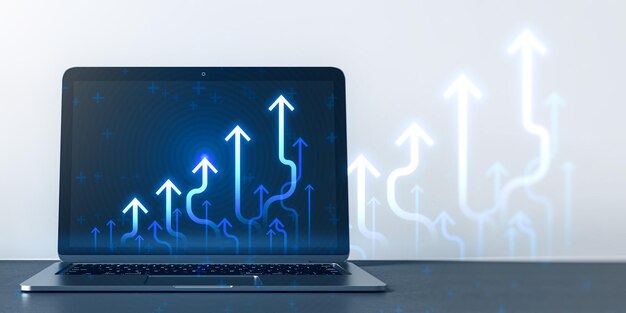 Foto close up di un computer portatile sul posto di lavoro con frecce di grafico aziendale blu in crescita sullo sfondo sfocato tendenza di successo e concetto di crescita finanziaria rendering 3d