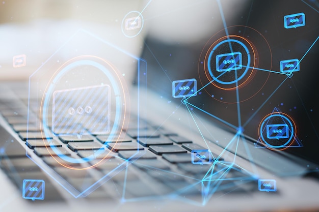 close up of laptop with creative glowing connected communication hologram on blurry background technology and wireless networking concept double exposure