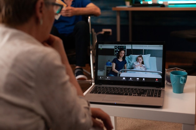 Close up of laptop with video call conference from family