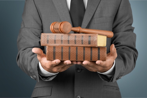 Close up lawyer with gavel judge and books