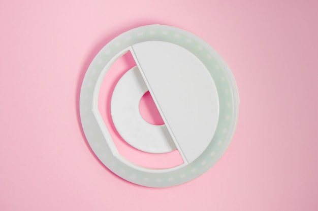 Close-up LED selfie circular ring light lamp on pink