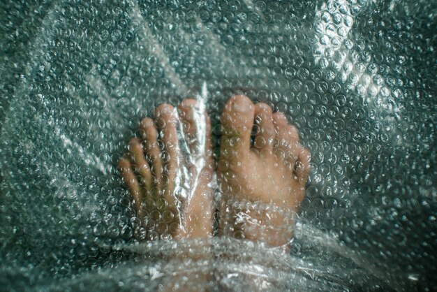 Photo close-up of legs under bubble wrap