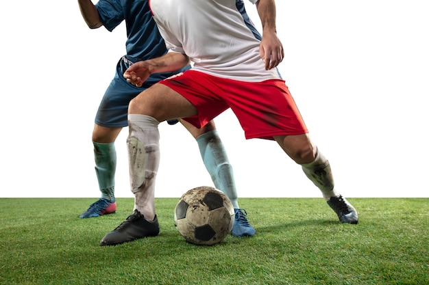 Close up legs of professional soccer, football players fighting for ball