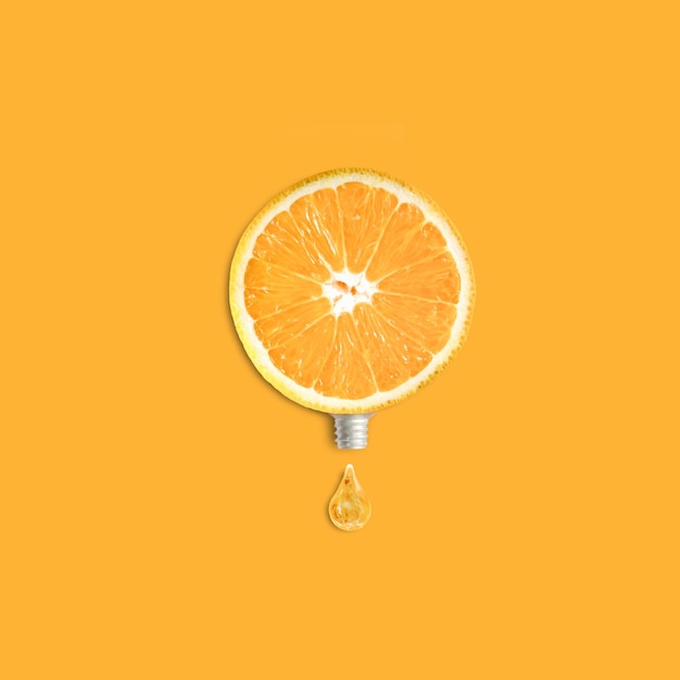 Close-up of lemon against orange background