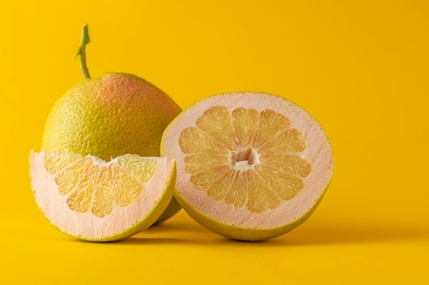 Close-up of lemon slice against yellow background