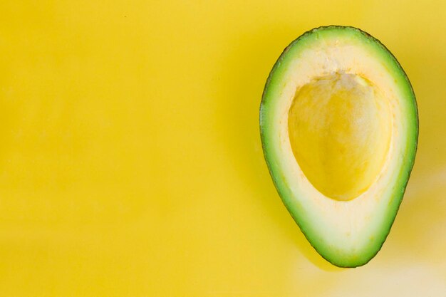 Close-up of lemon slice against yellow background