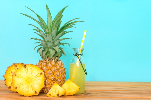 Close-up of lemon slice on table against blue background