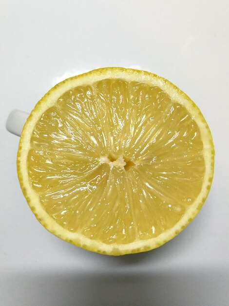 Close-up of lemon slice on table