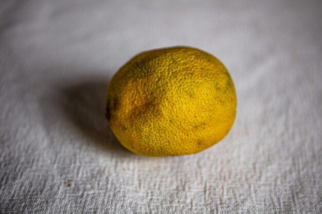 Close-up of lemon on table