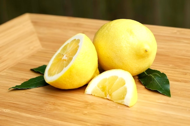 Close-up of lemons on wooden table