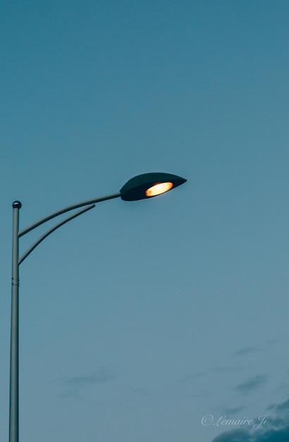 Close-up of light bulb against clear sky