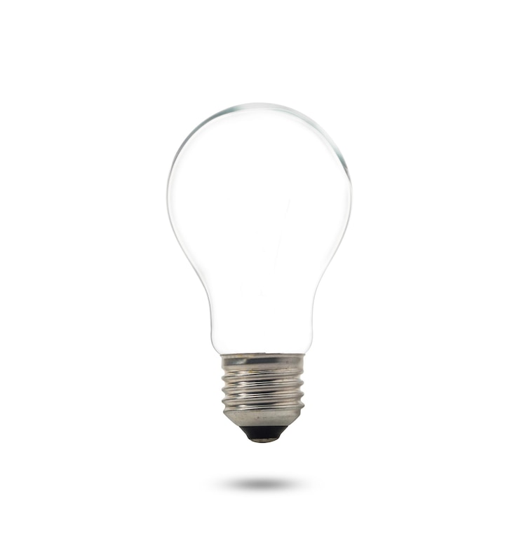 Photo close-up of light bulb against white background