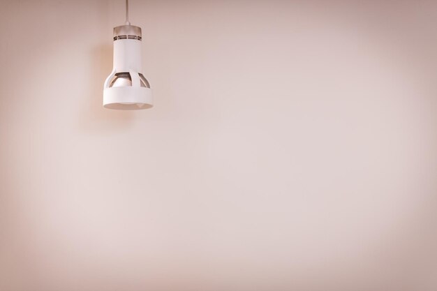 Close-up of light bulb hanging on ceiling