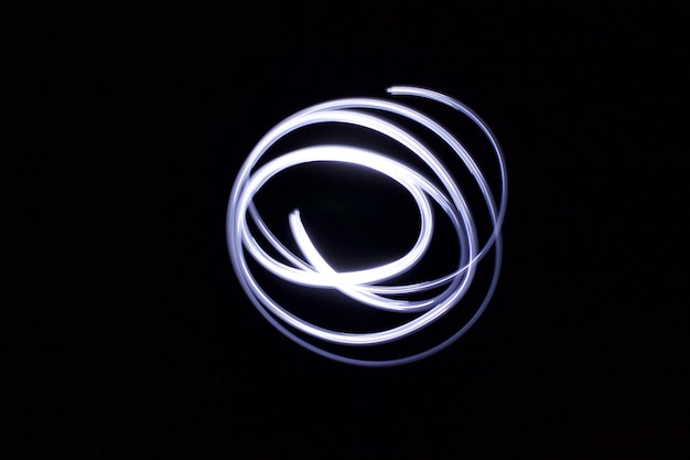 Close-up of light painting against black background