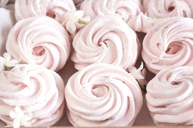 Close up of light pink marshmallows decorated with flowers