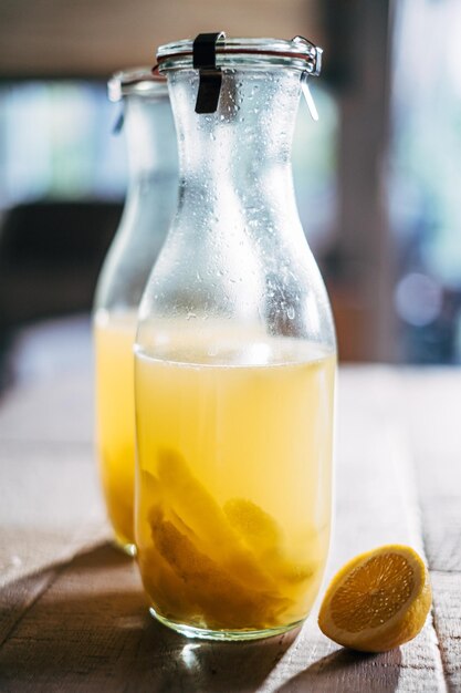 Close-up of limoncello in bottle on table