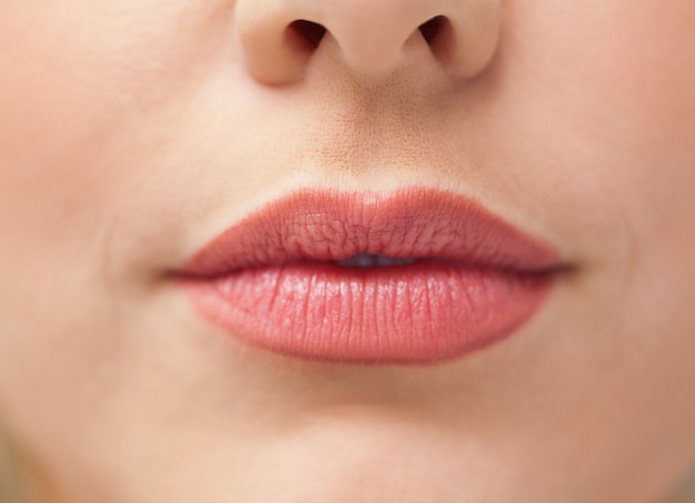 Close-up of lips with lipstick on them