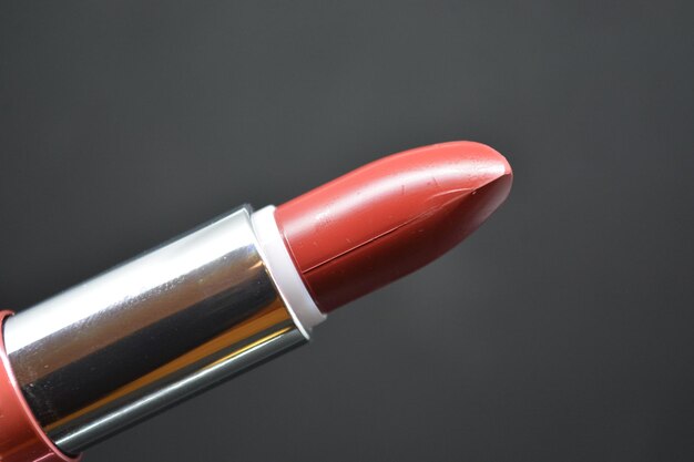 Close-up of lipstick against black background