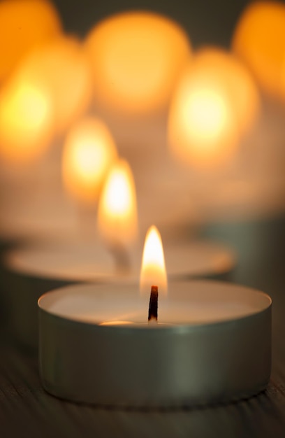 close-up of lit candles on table