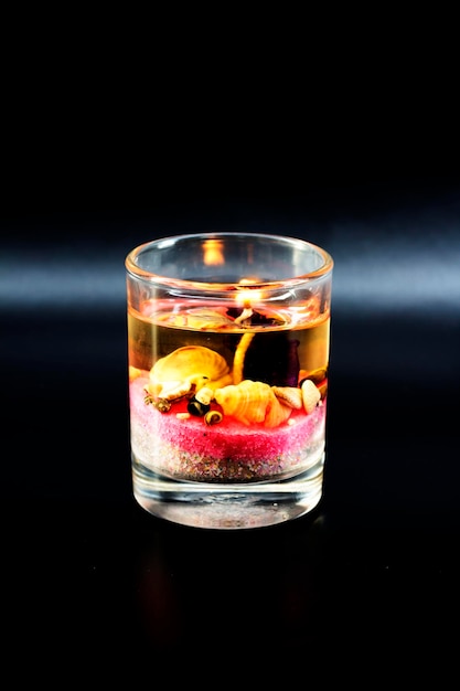 Close-up of lit tea light candle on table