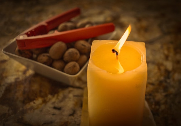 Close-up of lit yellow candle