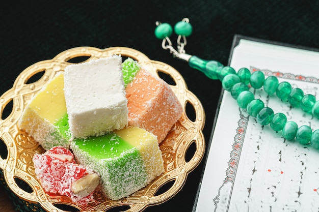 Close up of a little oriental plate with turkish delights sweets