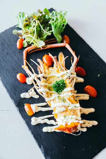 close-up of lobster served on slate