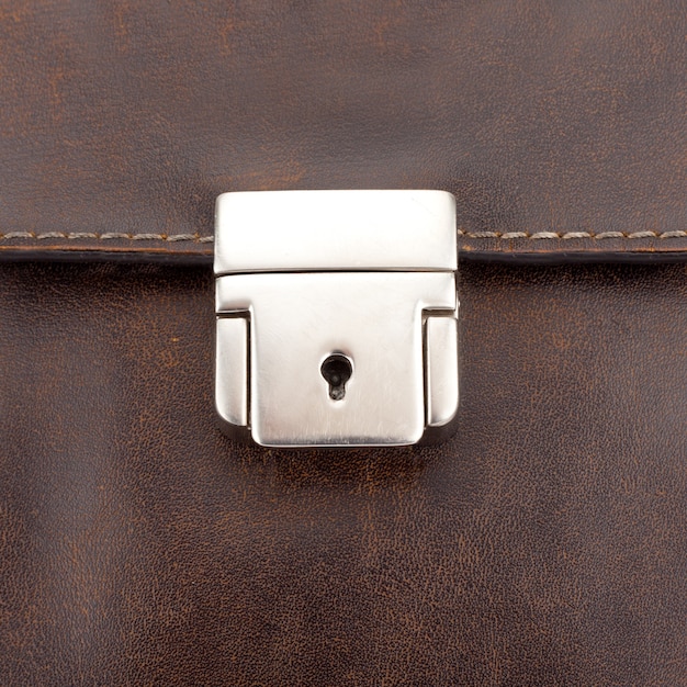 Close-up of lock on leather business case