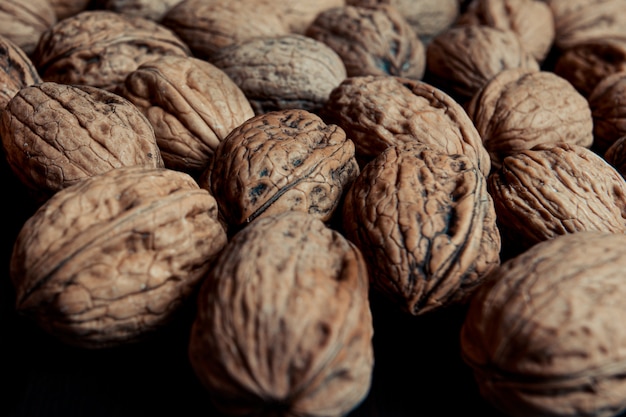 A close up of a lot of textured nuts