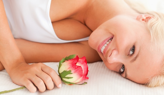 Close up of a lovely woman with a flower