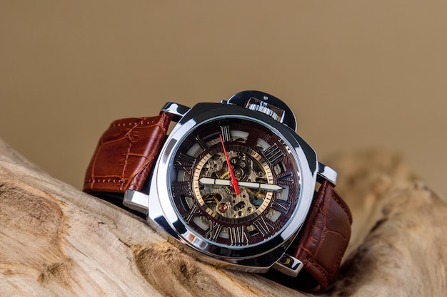 Close up of Luxury man wrist watches placed on timber in brown background