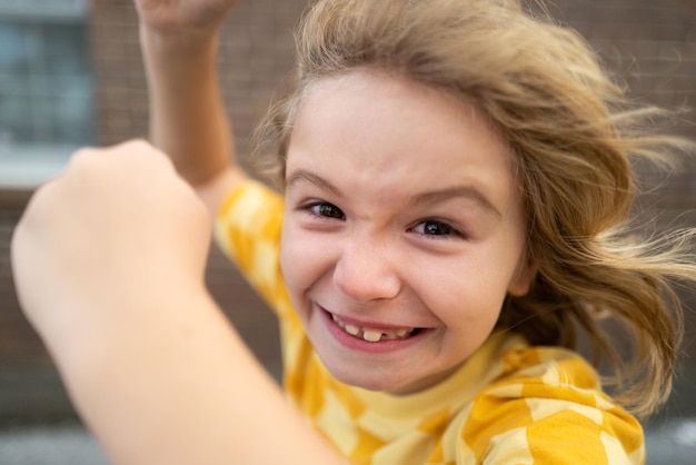 Close up mad face of kid with angry expression Angry hateful little aggression boy child furious Angry rage kids face Anger child with furious negative emotion portrait Angry behavior