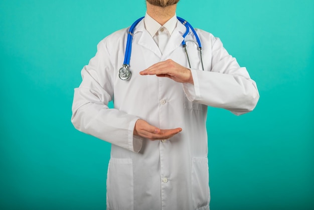 Close up of male doctor holding something in his hand Help and care concept