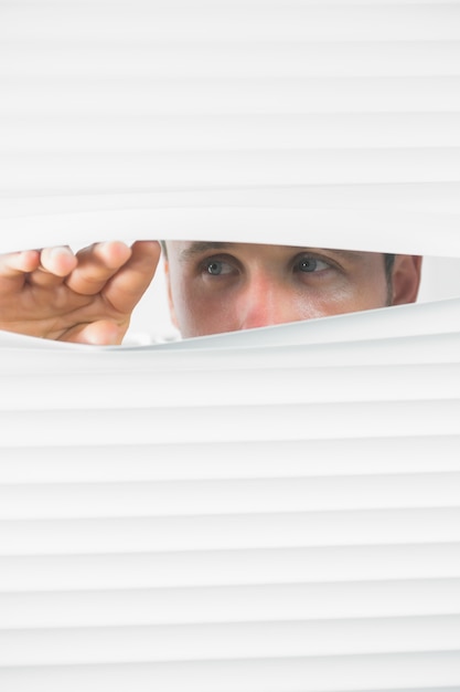 Close up of male eyes spying