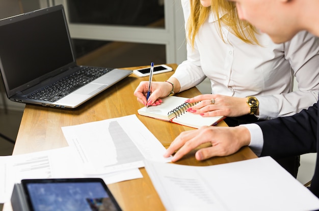 Close-up of male and female office workers.