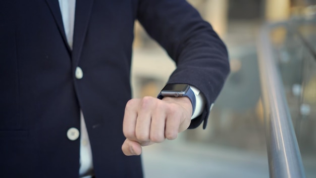 Close up of male finger swiping to the left on smartwatch