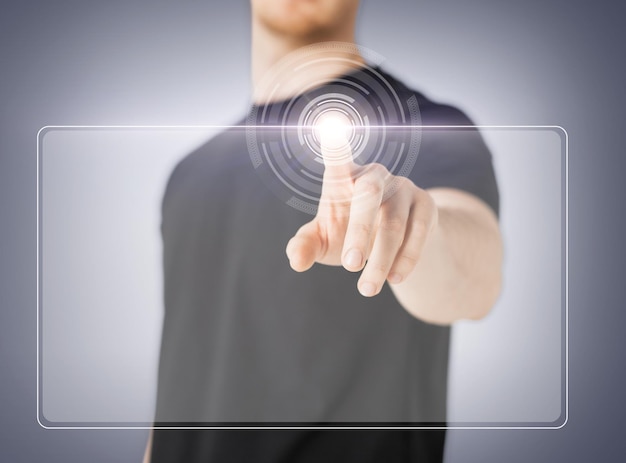 Photo close up of male hand touching virtual screen