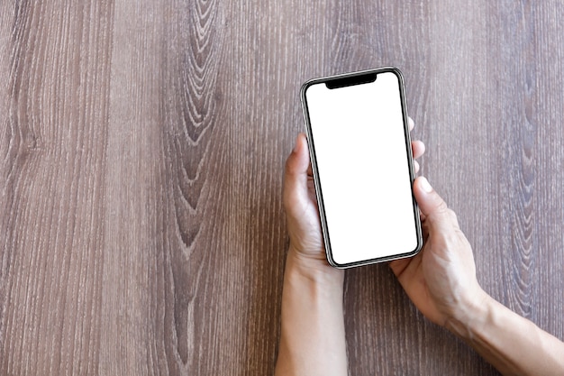 Close-up male hands holding blank screen smartphone