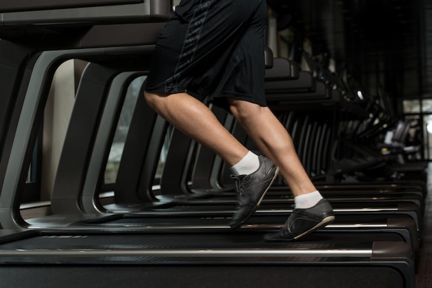 Close Up Of Male Legs Running On Treadmill  Blurred Motion