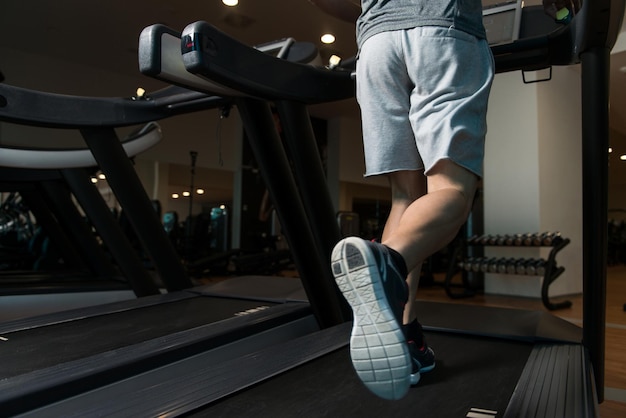 Close Up Of Male Legs Running On Treadmill Blurred Motion