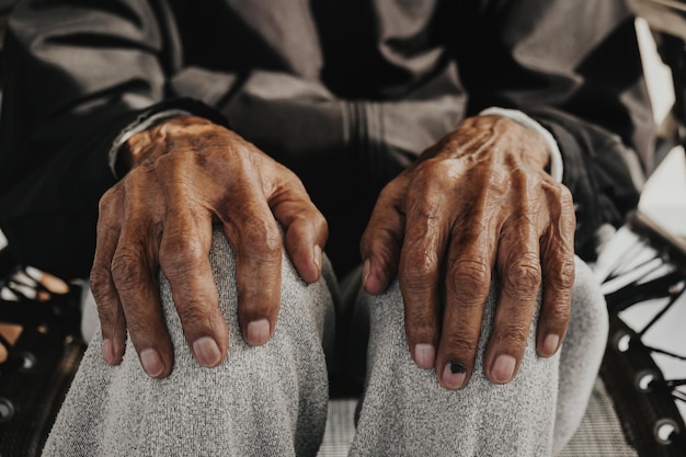 Close up of male wrinkled hands old man is wearing vintage tonexA