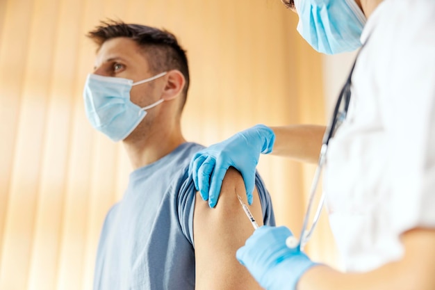 Close up of man getting his dose of insulin at hospital