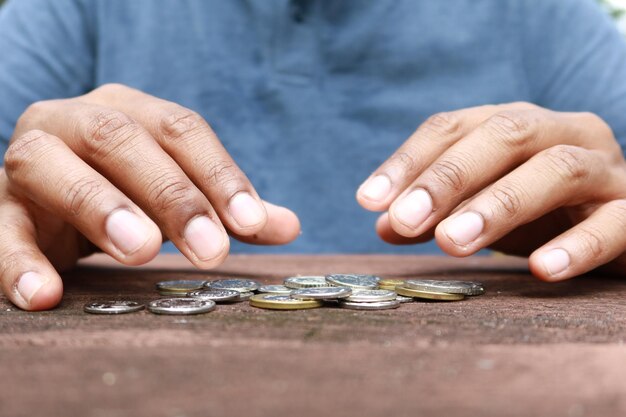 Close up of man hand counting coins