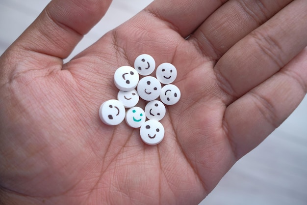 Close up of man hand taking pills