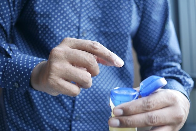 Close up of man hand using petroleum jelly